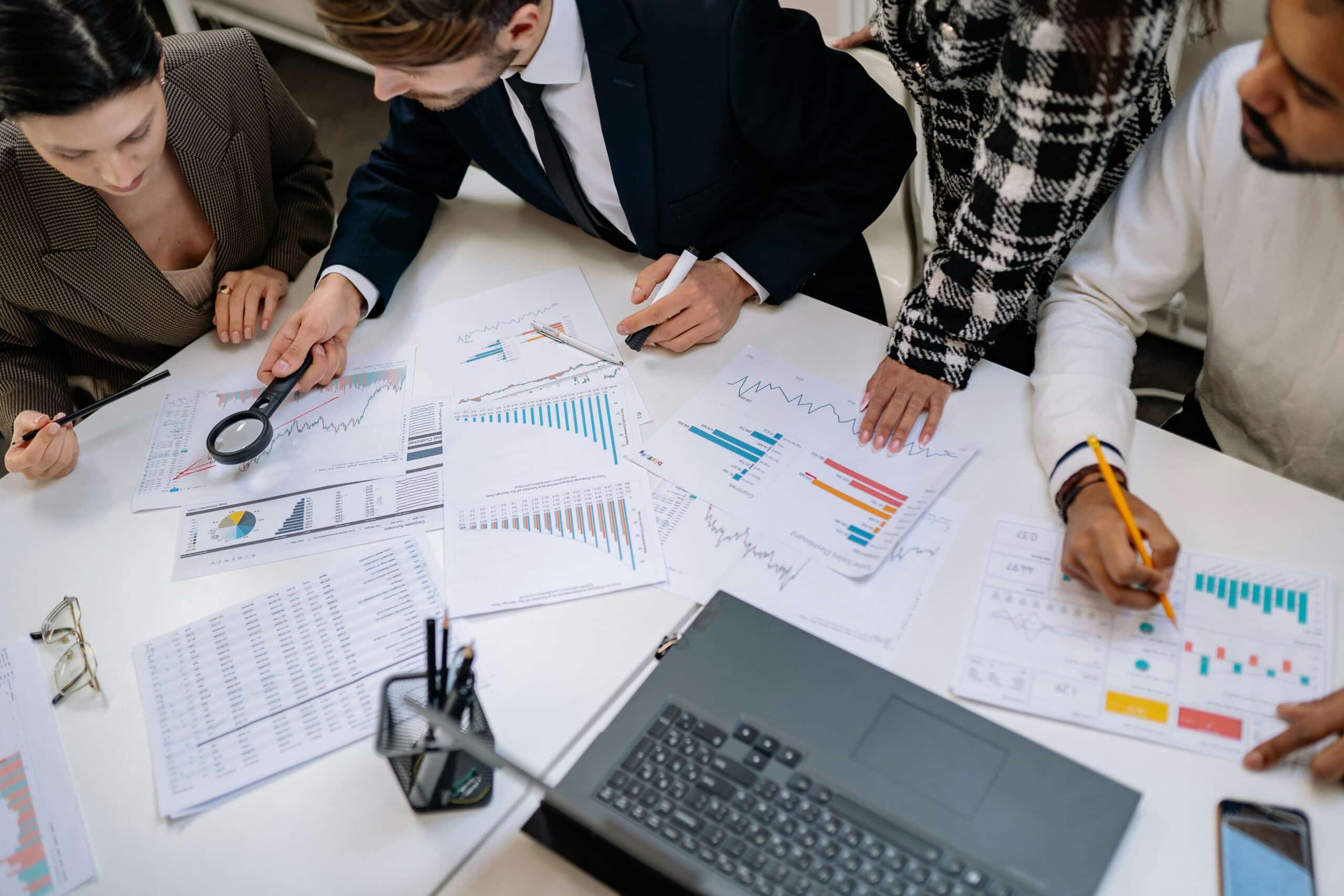 Not-for-profit team working with financial documents to develop budget forecasts and strategic funding plans